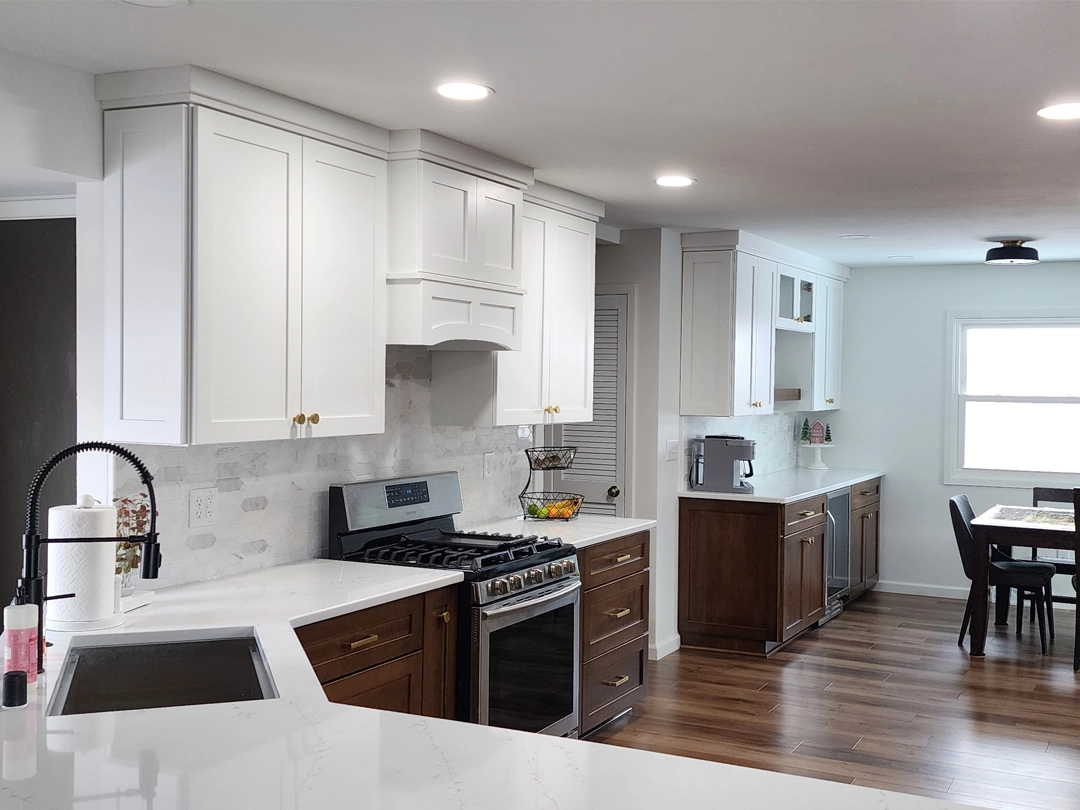 a kitchen with white cabinets and white countertops